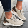 Khaki lace-up sneaker with perforated toe and cushioned sole