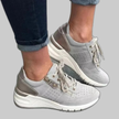 Grey lace-up sneaker with perforated toe and cushioned sole