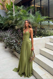 Women's Pleated Evening Dress Maxi in Green - Model at outdoor tropical garden venue