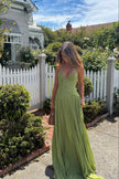 Women's Pleated Evening Dress Maxi in Green - Model with clutch bag outdoors