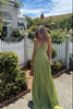 Women's Pleated Evening Dress Maxi in Green - Model with clutch bag outdoors