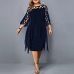 Woman wearing a deep blue flowy midi dress