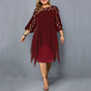 Woman wearing a wine red flowy midi dress