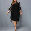 Woman wearing a black flowy midi dress
