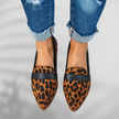 Front view of leopard-print pointed-toe loafers with black leather trim