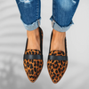 Front view of leopard-print pointed-toe loafers with black leather trim