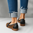 Back view of leopard-print loafers with black heel counter