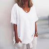 Woman wearing a white oversized round neck top