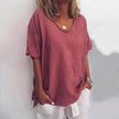 Woman wearing a dark pink oversized round neck top