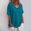 Woman wearing a sea blue oversized round neck top