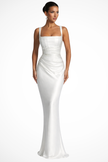 Woman wearing a white satin evening gown with a square neckline