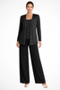 Woman wearing a black sequin jacket, camisole, and wide-leg trouser three piece set
