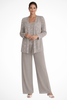 Woman wearing a taupe sequin jacket, camisole, and wide-leg trouser three piece set