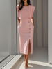 Woman in soft pink sleeveless midi dress with structured padded shoulders and elegant gold side buttons
