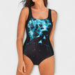 Woman wearing a blue and black abstract print swimsuit