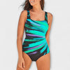 Woman wearing a green and black abstract print swimsuit