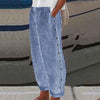 Royal blue striped wide-leg pants with side button placket, side view