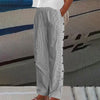 Black and gray striped wide-leg pants with side button placket, side view