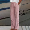Red striped wide-leg pants with side button placket, side view
