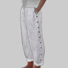 Off white striped wide-leg pants with side button placket, side view