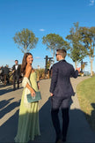 Women's Summer Pleated Evening Dress Maxi in Green - Model at outdoor garden event