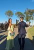 Women's Summer Pleated Evening Dress Maxi in Green - Model at outdoor garden event