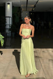Women's Summer Pleated Evening Dress Maxi in Green - Full length view with flowing skirt at indoor venue
