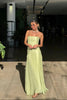 Women's Summer Pleated Evening Dress Maxi in Green - Full length view with flowing skirt at indoor venue
