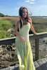 Women's Summer Pleated Evening Dress Maxi in Green - Model in sage green pleated maxi outdoors
