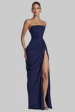 Woman wearing a dark blue strapless ruched maxi dress with a thigh slit