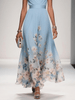 Women's V-Neck Floral Dress Maxi in Light Blue — close-up of flowing A-line skirt with delicate floral border print