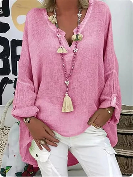 Woman wearing a pink oversized V-neck top
