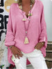 Woman wearing a pink oversized V-neck top