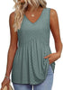 Woman wearing a green textured V-neck peplum top
