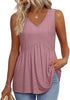 Woman wearing a light pink textured V-neck peplum top