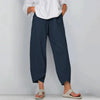 Model in navy blue wide leg casual pants with unique cropped asymmetric hem and drawstring waist